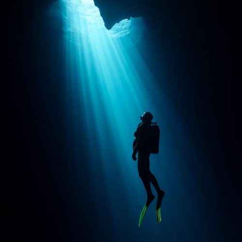Diver Rising Toward Light – Minimalist Deep-Sea Photography with Dreamlike Adventure Vibes